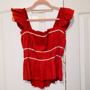 New with tags. Free people tank with ties. Red size S.